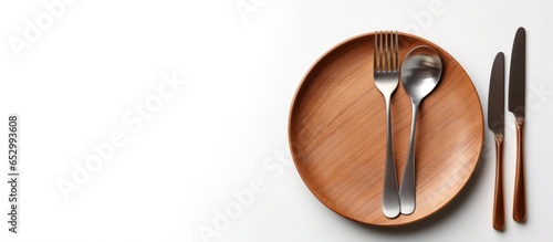 Balanced food with various products seen from above next to cutlery on white background