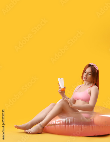 Young woman with inflatable...