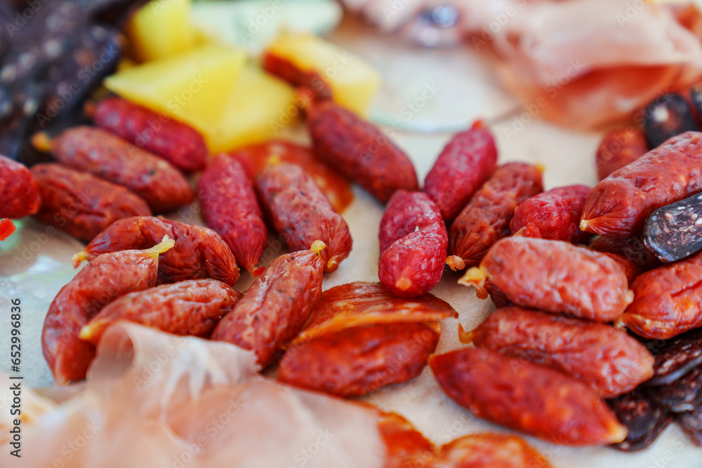 A tray with cheese and meat appetizers on the banquet table. A tray with cheese and meat appetizers on the banquet table.