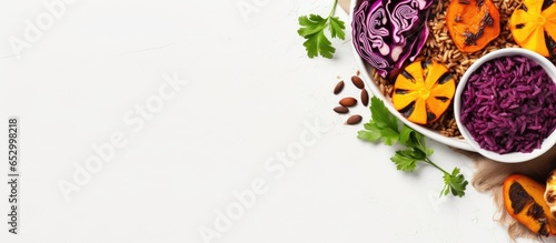 Vegetarian concept Buddha bowl with wild rice pumpkin and red cabbage Top view on a light background