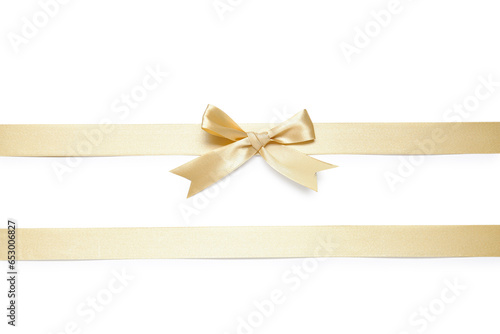 Bow made from golden satin ribbon on white background