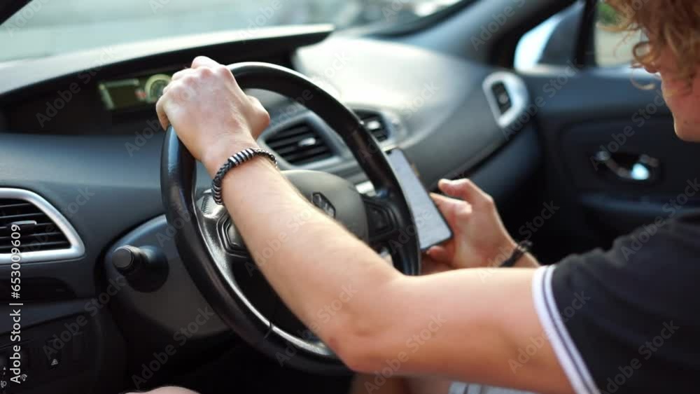 man looking at phone while driving. High quality FullHD footage man looking at phone while driving. High quality FullHD footage