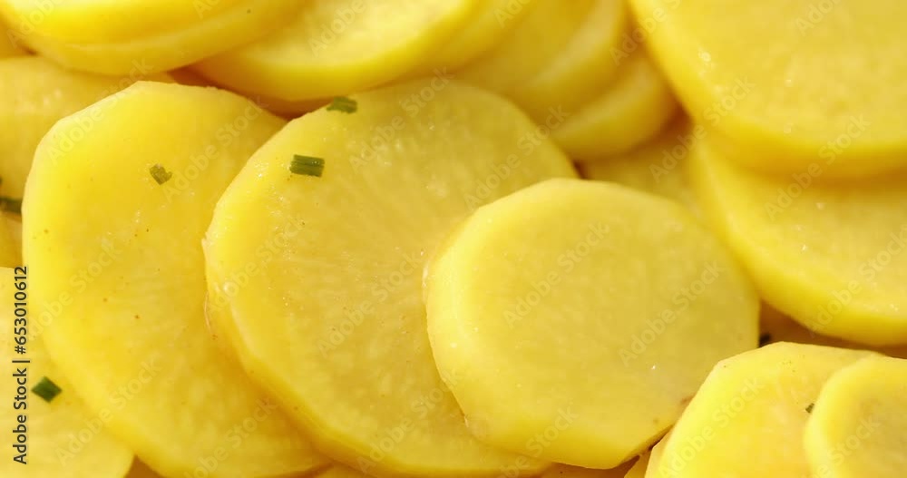Oven baked potatoes. Hot Potato Slices with steam. Prepared food. Close-up dolly shot. Oven baked potatoes. Hot Potato Slices with steam. Prepared food. Close-up dolly shot.