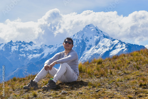 Happy man on top of mountain watching the snowy Veronica on the way from Intipunku to Perolniyoc Cusco, Ollantaytambo photo