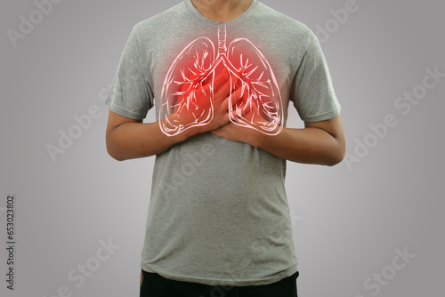 Quadro su tela Male person holding chest, feeling pain with lung illustration on the torso, res