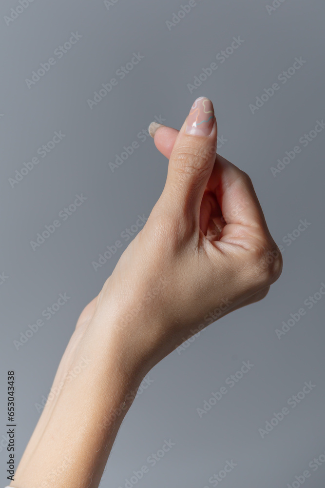 Female Hand Making the Heart Sign Close up Female Hand Making the Heart Sign Close up