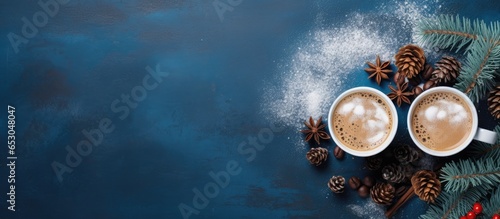 Festive coffee cups with numbers over frothy surface on rustic blue background perfect for welcoming the New Year