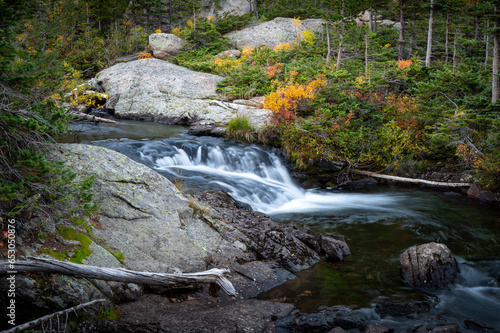 Fototapeta Naklejka Na Ścianę i Meble -  Small Waterfall With Fall Colors
