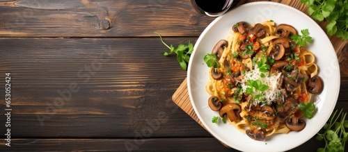 Italian food concept Healthy cookery with pasta mushrooms parsley and cheese on a grey table background viewed from above