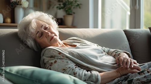 Depressed elderly woman lying on the sofa Depression, ADHD, mental health problems