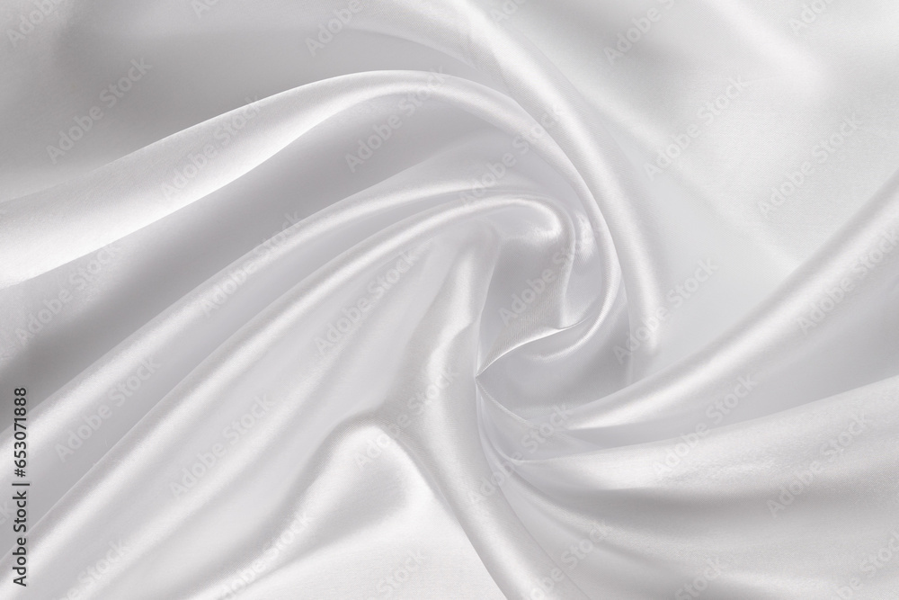 Abstract white silk fabric texture background. Cloth soft wave. Creases of satin Abstract white silk fabric texture background. Cloth soft wave. Creases of satin
