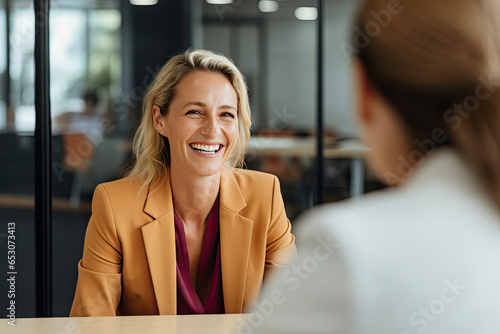 Two women engaged in conversation at a table