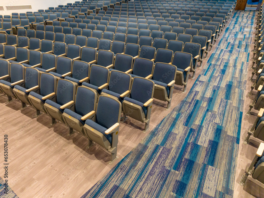 Fototapeta premium Overhead view of empty gray and blue theater, auditorium seats, chairs.