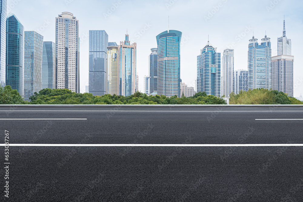 financial district buildings of shanghai and empty highway in sunny day