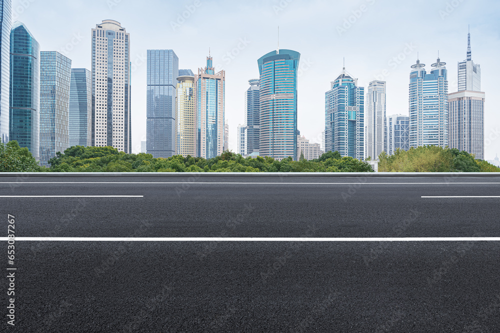 financial district buildings of shanghai and empty highway in sunny day financial district buildings of shanghai and empty highway in sunny day