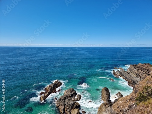 Cliff face and rocks in the ocean at Bennetts Head Lookout Forster New South Wales Australia