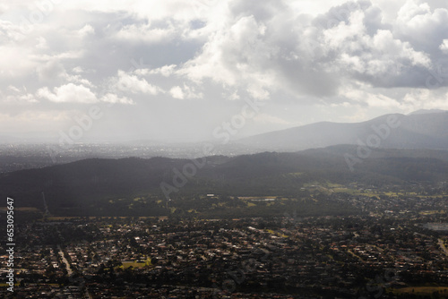 Aerial Perspective into Suburban Neighborhoods and Natural Landscape