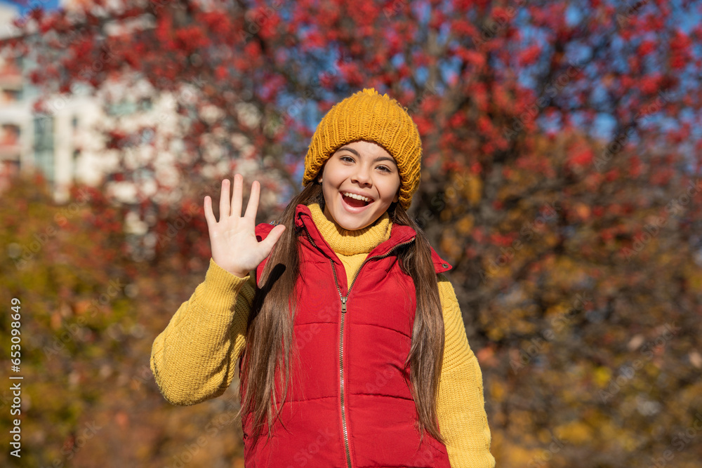 happy teen girl at school time outdoor in autumn season. hello happy teen girl at school time outdoor in autumn season. hello
