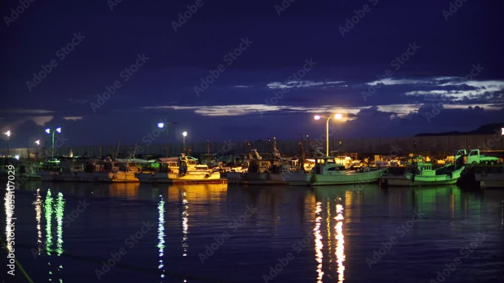 Night, evening, several boats floating on the harbor's sea, sparkling lights and reflections on the water surface.
Night, evening, several boats floating on the harbor's sea, sparkling lights and reflections on the water surface.