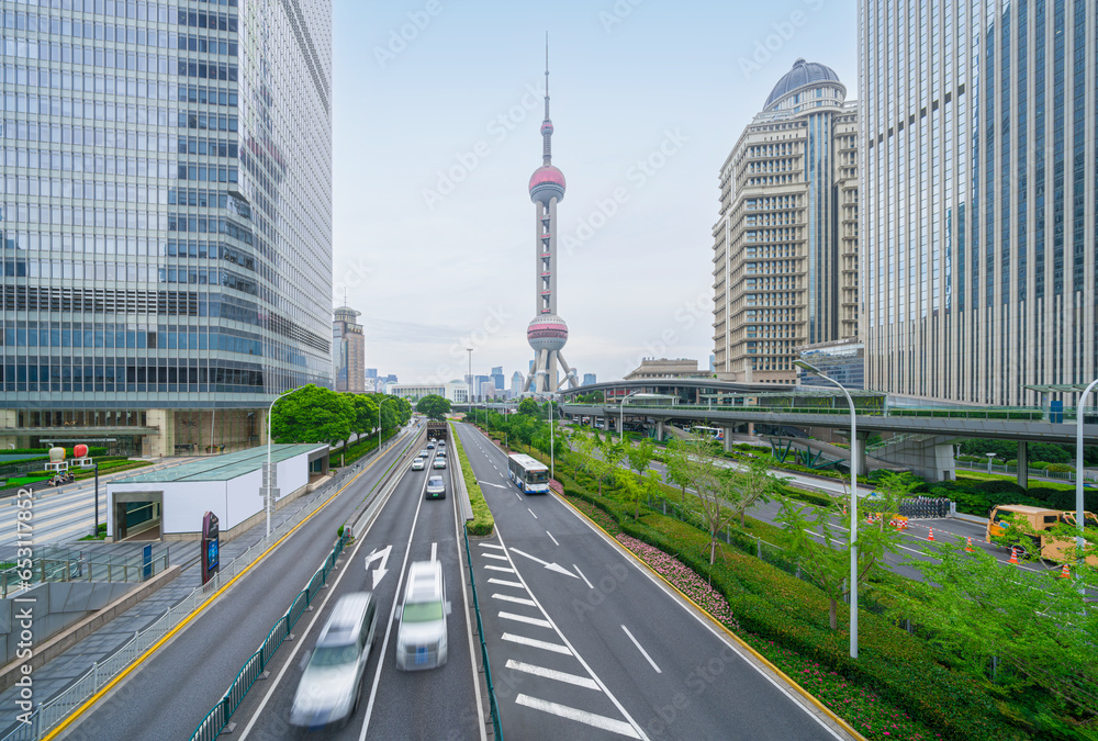 financial buildings in the Bund of Shanghai and moving bus on the highway financial buildings in the Bund of Shanghai and moving bus on the highway