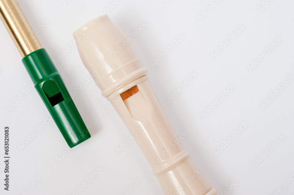 Irish whistle and block flute are longitudinal flutes with a whistle device and playing holes. Irish whistle and block flute are longitudinal flutes with a whistle device and playing holes.