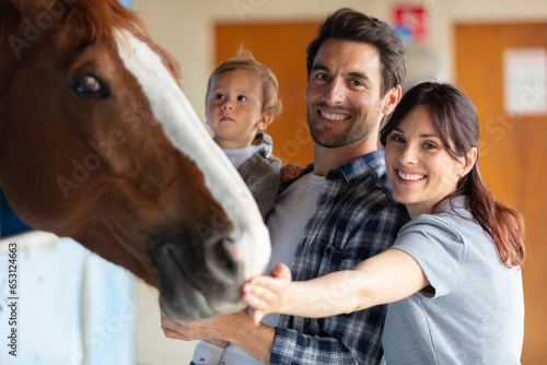happy family in a horse farm