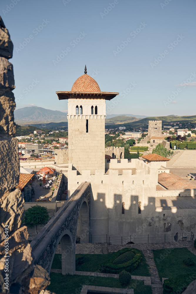 Akhaltsikhe (Rabati) Castle, medieval fortress built in the 9th century. Located in Akhaltsikhe city in southern Georgia. View of tower and battlement from above. Mountains on the background 