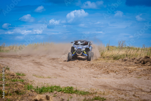 UTV in action offroad vehicle racing on sand dune. Extreme, adrenalin. 4x4.