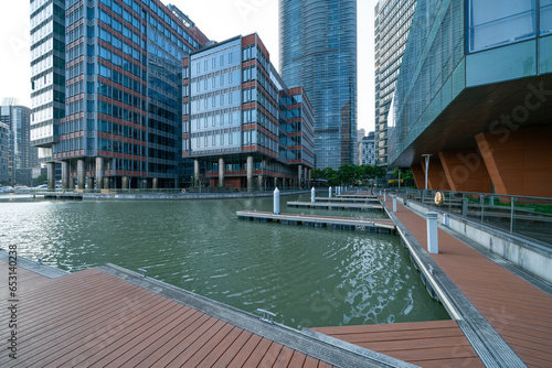 Canvas Print financial district buildings of shanghai in sunny day, and the yacht docked at t