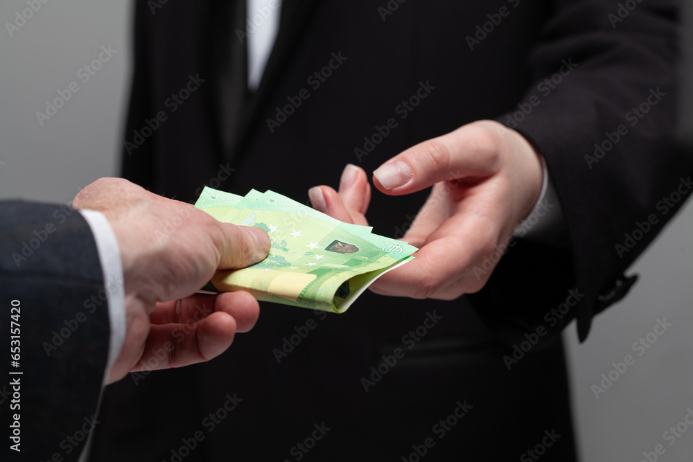 Money cash euro banknote in human hand. Deal, salary and credit concept - obrazy, fototapety, plakaty 