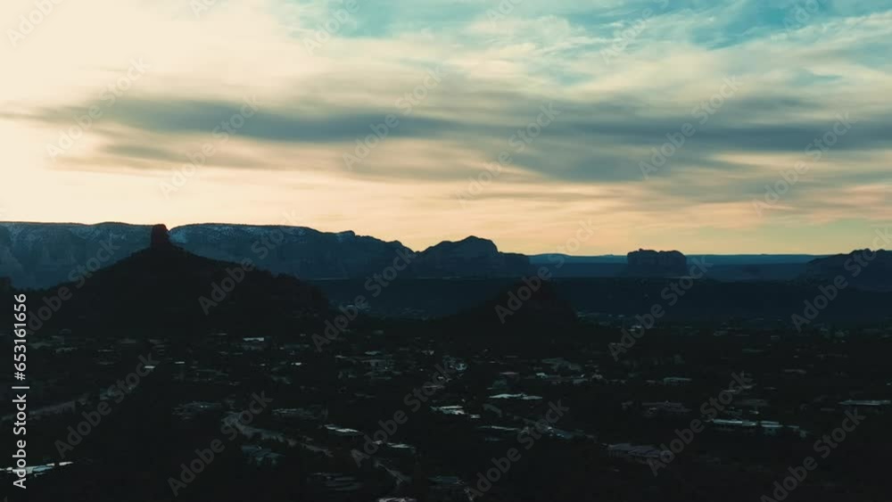 Silhouetted Mountains Over Sedona Town During Sunset In Arizona, USA. Aerial Drone Shot Silhouetted Mountains Over Sedona Town During Sunset In Arizona, USA. Aerial Drone Shot