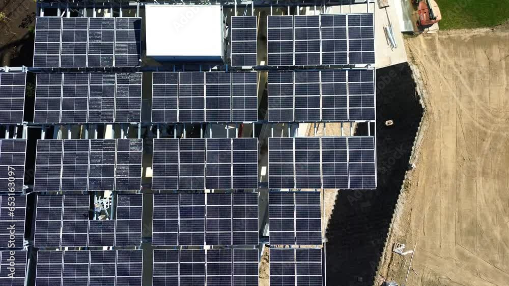 Roof Top solar panels on modern building Ohio State University -new construction - aerial drone Roof Top solar panels on modern building Ohio State University -new construction - aerial drone