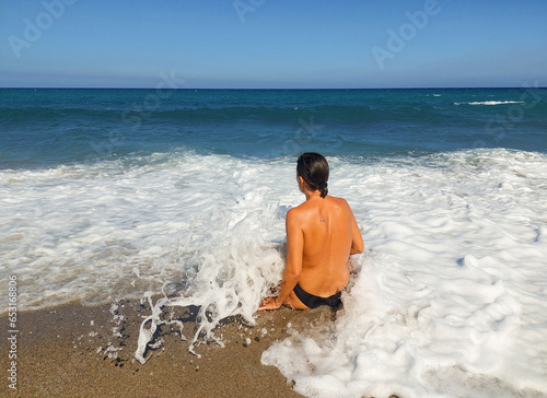 girl swimming among the waves in Cabo de Gata Almería