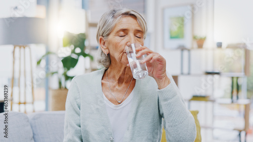 Wellness, home or healthy old woman drinking water for healthcare or natural vitamins in a house. Retirement, elderly relaxing or thirsty senior person refreshing with liquid for energy or hydration