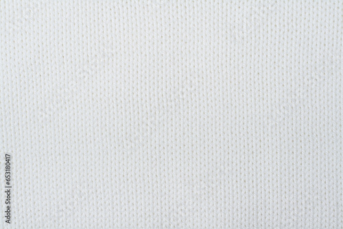 Sweater or scarf fabric texture large knitting. Knitted jersey background with a relief pattern. Wool hand- machine, handmade.