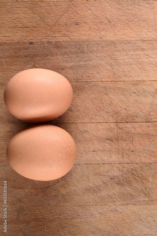 Top View Close-up of Fresh Brown Eggs on Wooden Table - 4K Image