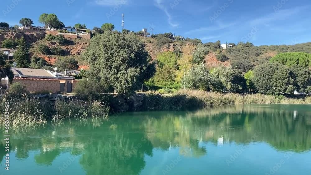 The turquoise and crystal-clear waters of Laguna de San Pedro in the Lagunas de Ruidera, Albacete, Castilla-La Mancha, Spain The turquoise and crystal-clear waters of Laguna de San Pedro in the Lagunas de Ruidera, Albacete, Castilla-La Mancha, Spain
