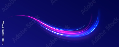 Abstract long exposure dynamic speed light trails background. Neon color glowing lines background, high-speed light trails effect. 