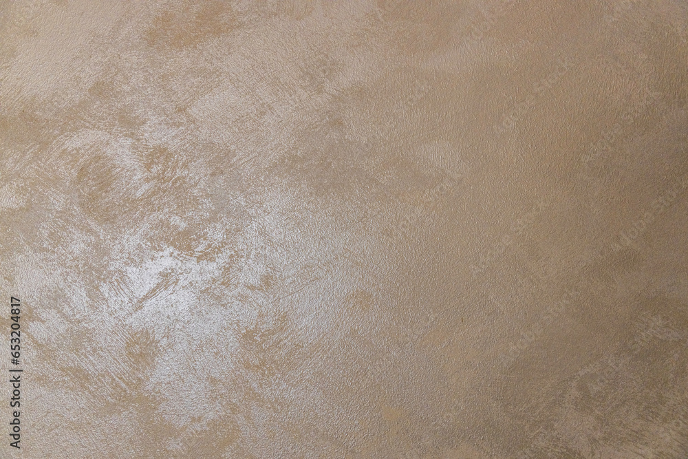 Naklejka premium golden texture background. The texture of golden decorative plaster or concrete. Abstract grunge background for design. background texture of gold foil