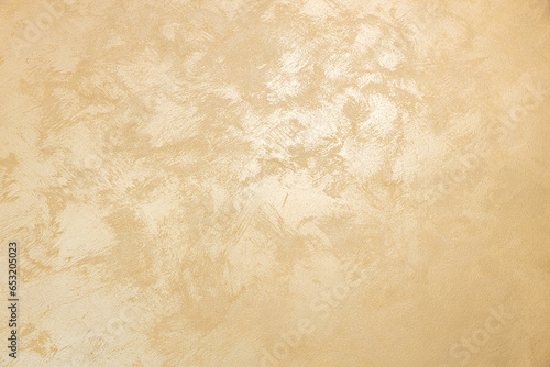 golden texture background. The texture of golden decorative plaster or concrete. Abstract grunge background for design. background texture of gold foil