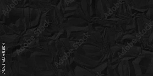 Dark crumple black fabric paper wrinkled poster template ,blank glued creased paper texture background. black paper crumpled backdrop background. used for cardboard and clarkboard.