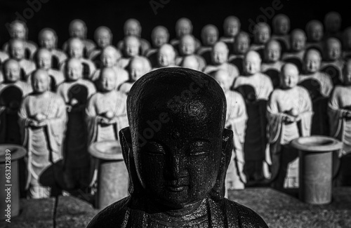 Hundreds of jizo statues lined up at the Hasedera Temple, Kamakura, Honshu, Japan photo
