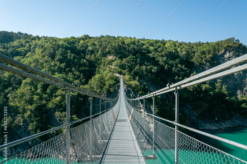 suspension bridge over the Drac river, Lac Monteygnard, French alps