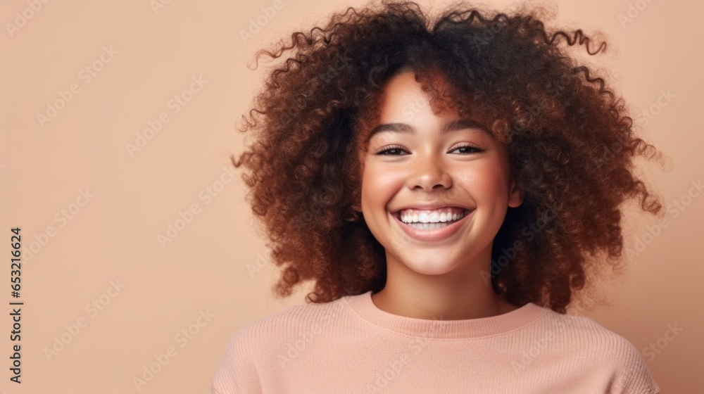 A carefree teenage girl radiates positivity in a portrait set against a bright, minimalist backdrop. A carefree teenage girl radiates positivity in a portrait set against a bright, minimalist backdrop.