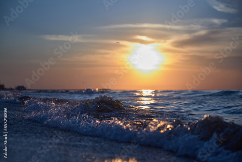 Orange-gold sunset, sky, sunlight, summer mood landscape with sea sunset on beach.