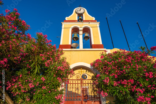 View of church bell tower overlooking Fiscardo harbour, Fiscardo, Kefalonia, Ionian Islands, Greek Islands