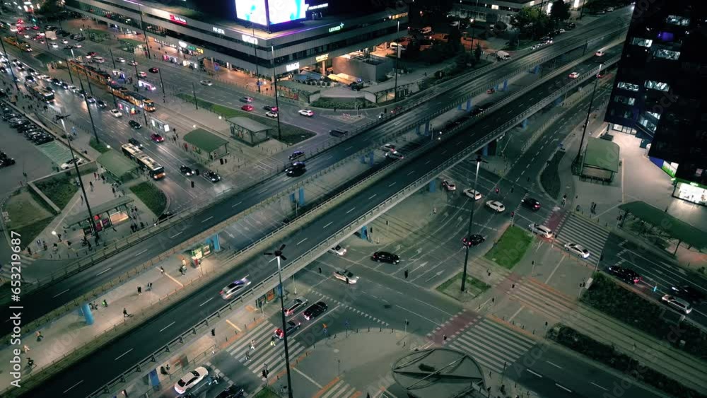 Aerial drone night video of illuminated Crossroad, multi lane highway through urban city center popular multilevel junction Aerial drone night video of illuminated Crossroad, multi lane highway through urban city center popular multilevel junction