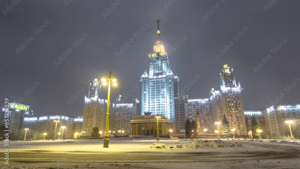The Main Building of Moscow State University front view on Sparrow Hills at Enchanting Winter Night Timelapse Hyperlapse. This iconic university is illuminated, creating a captivating nighttime scene The Main Building of Moscow State University front view on Sparrow Hills at Enchanting Winter Night Timelapse Hyperlapse. This iconic university is illuminated, creating a captivating nighttime scene