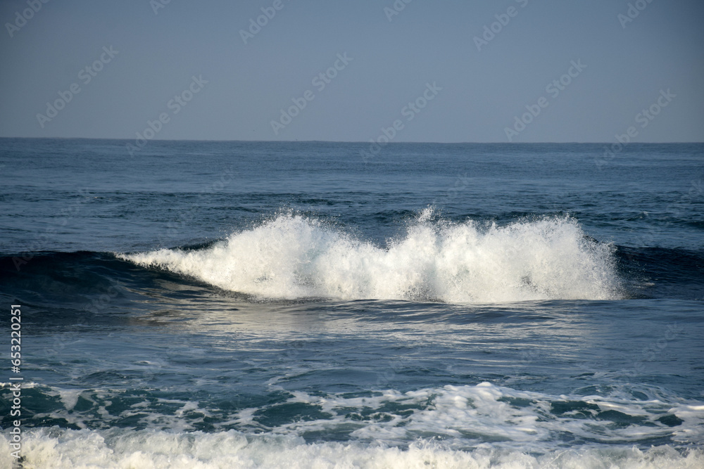 beach waves on a sunny morning, beach waves break the calm on the beach beach waves on a sunny morning, beach waves break the calm on the beach