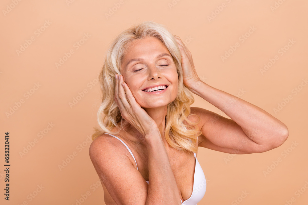 Photo of positive pensioner lady enjoy dermatology skin care procedure face lifting isolated pastel color background
